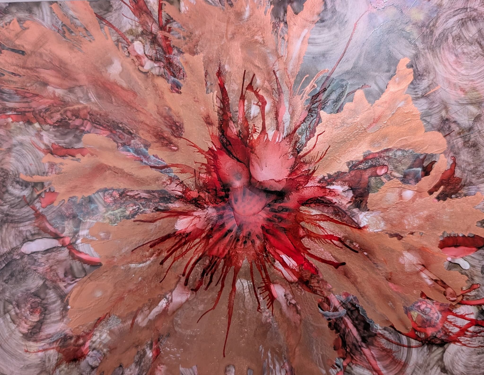 Copper and red ink swirl