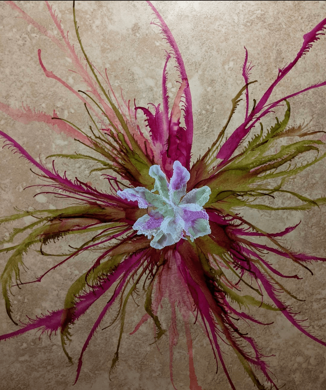 Pink and green radial ink on stone